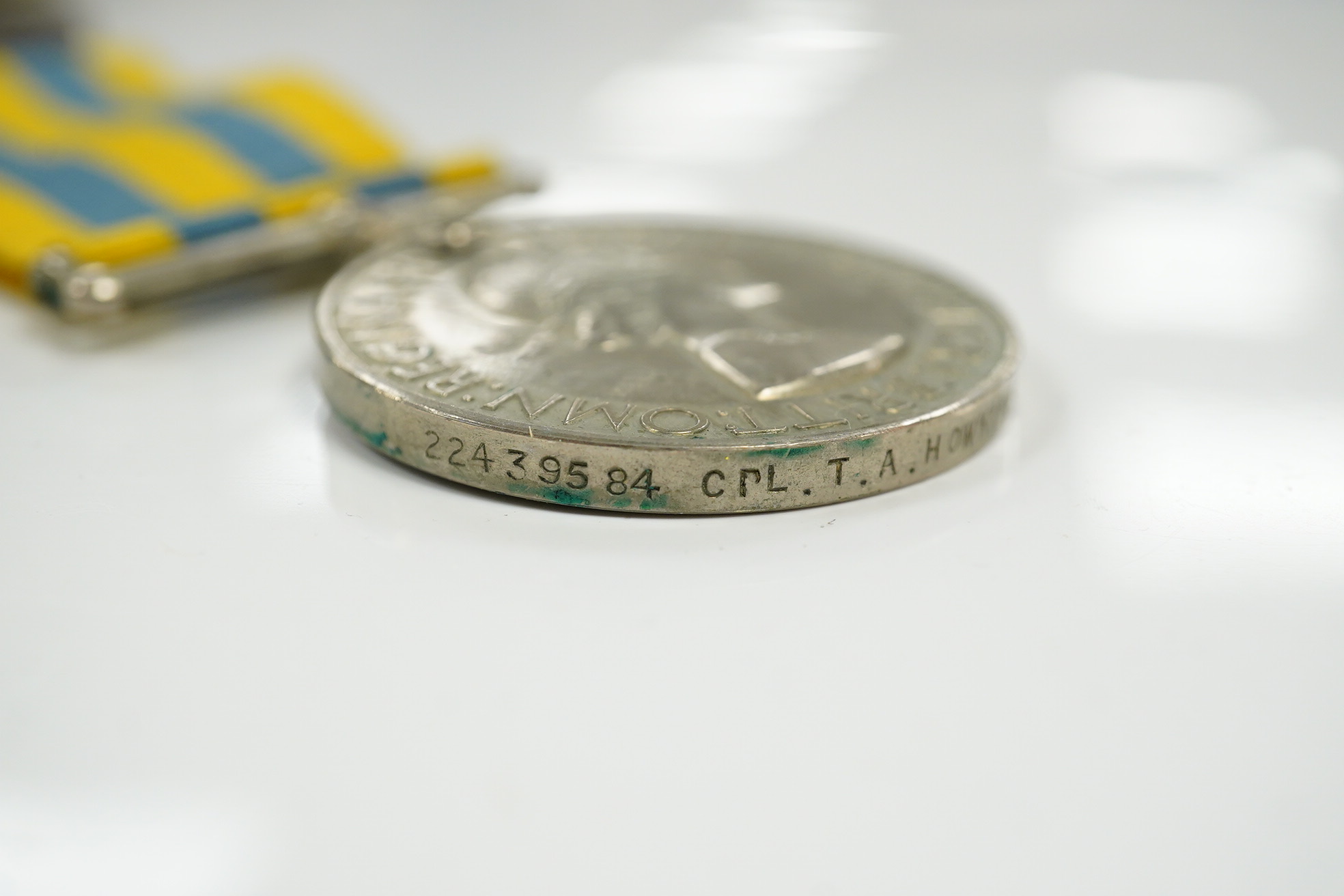 A First World War medal pair awarded to SJT. F.C. Howkins, The Queen’s R., together with a QEII Korea medal pair awarded to CPL. T.A. Howkins, R. Norfolk, plus a Lusitania propaganda medallion, all contained in a Princes